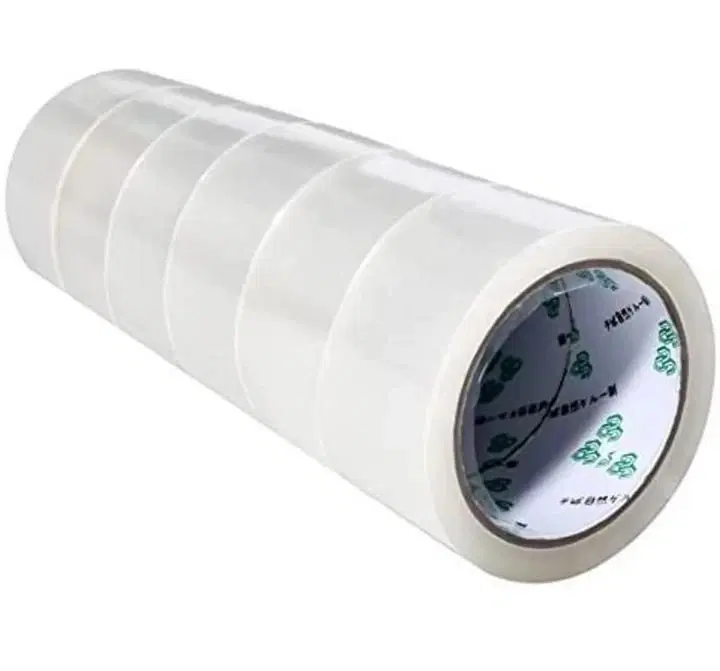 Set of transparent adhesive packing tape rolls stacked together on a white background