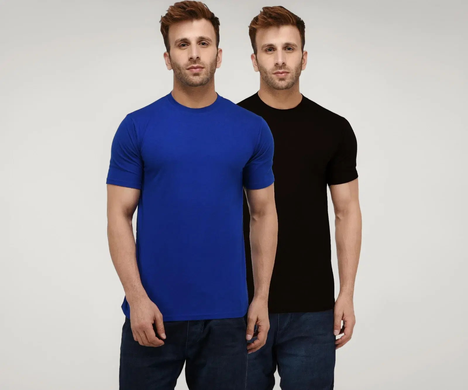 Two men wearing solid crew neck T-shirts in blue and black with jeans