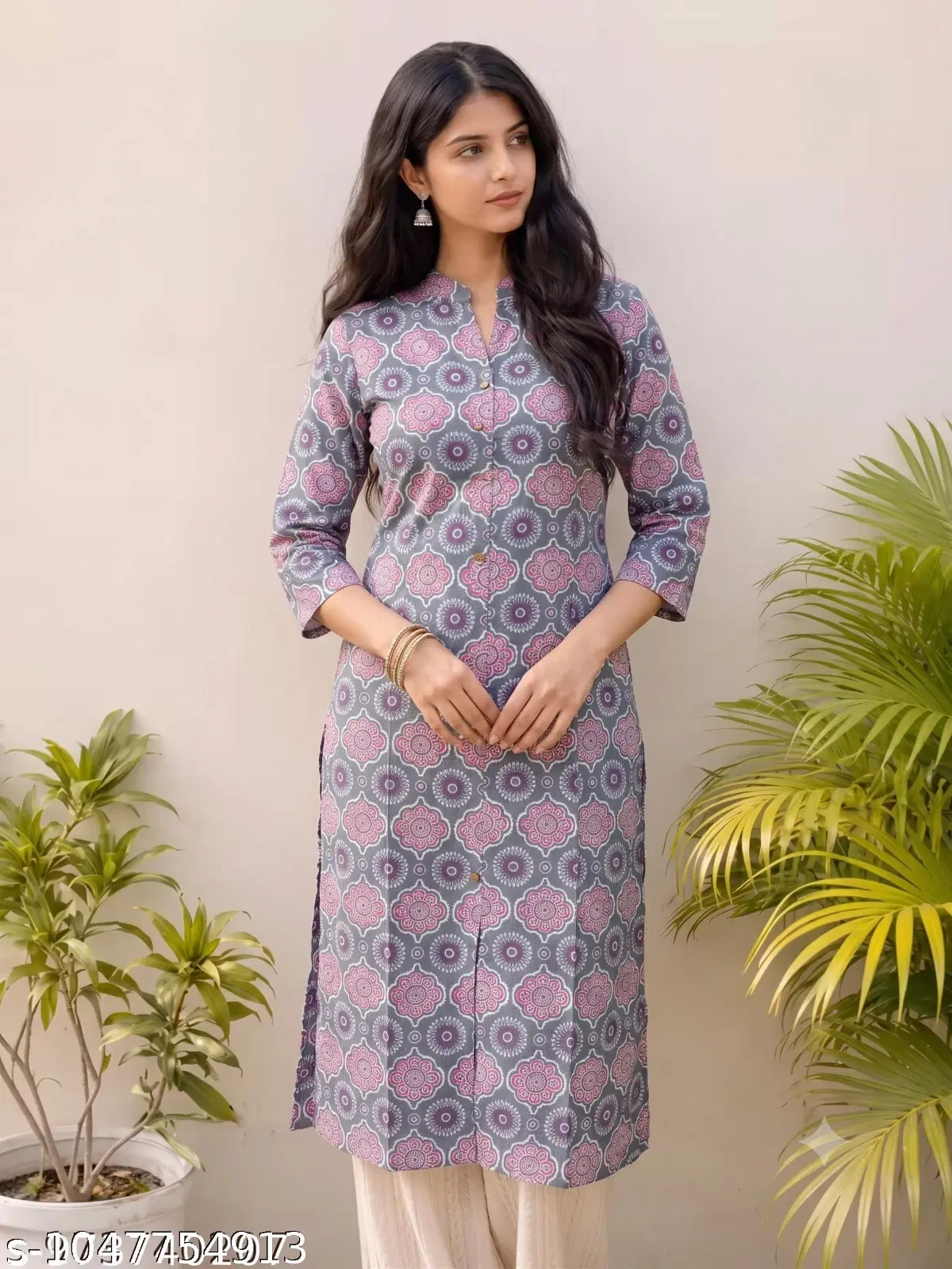 Woman wearing a grey printed straight kurta with three-quarter sleeves and cream bottoms