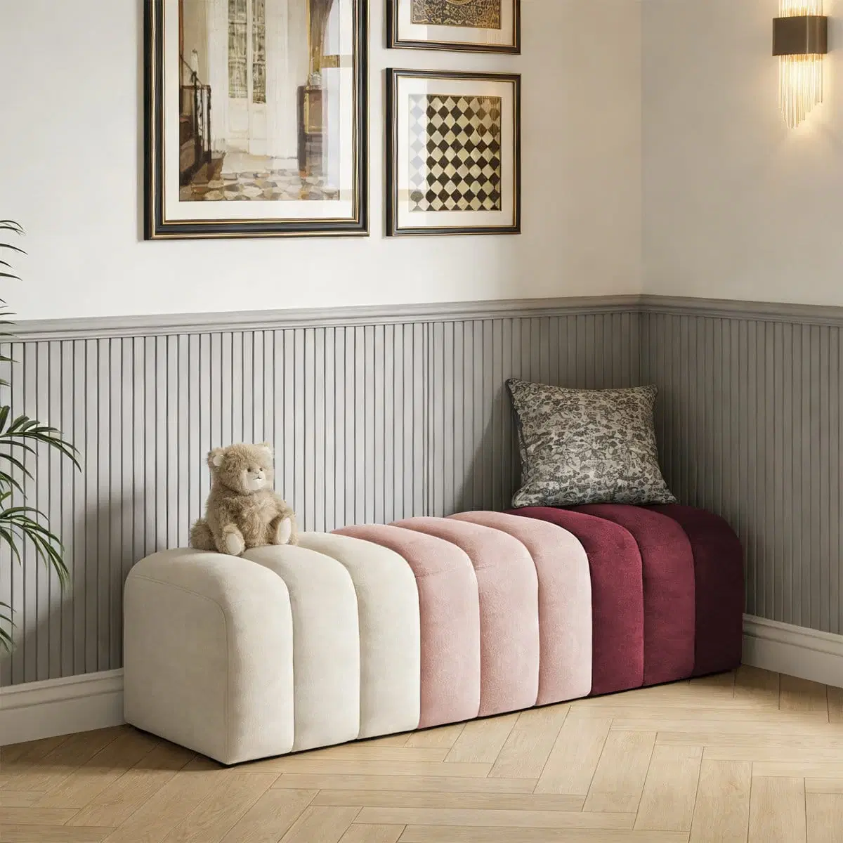 Color-block upholstered bench in a corner setting with cream, blush and burgundy channel sections