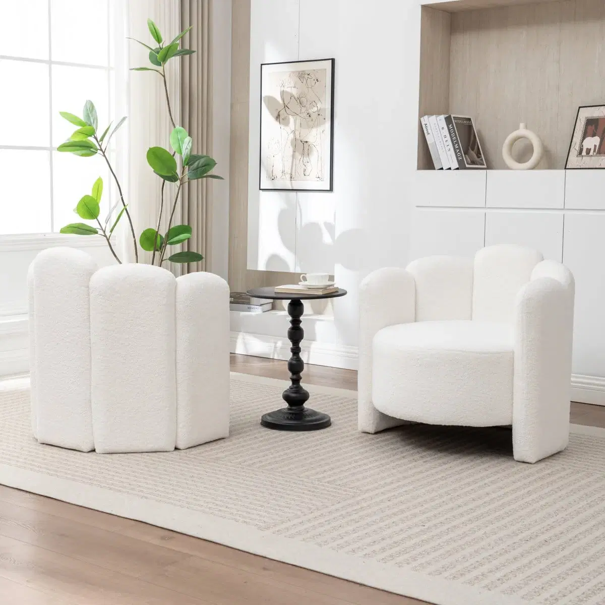Off-white boucle accent chair styled in a modern living room beside a black side table
