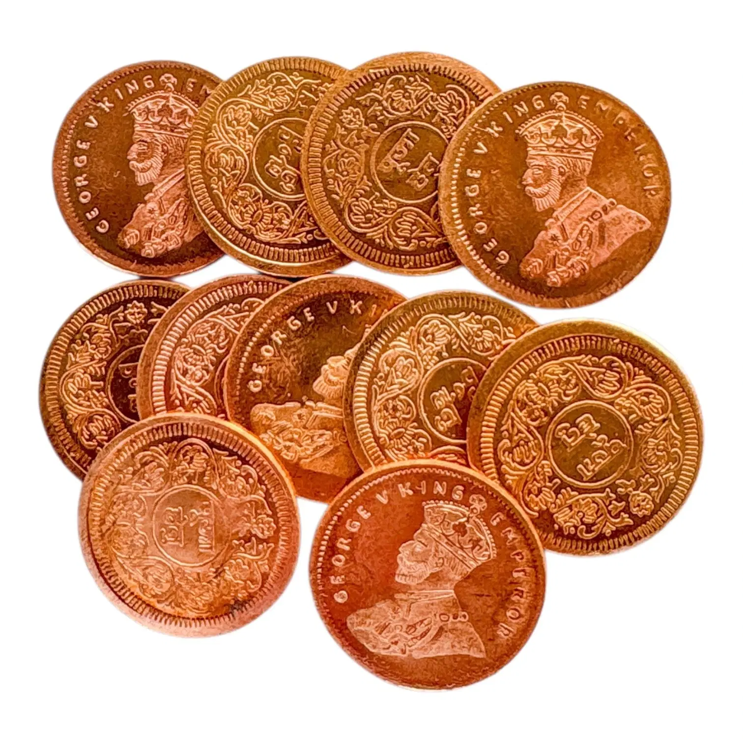 11 copper  coins spread out, showing and  ornate floral reverse designs