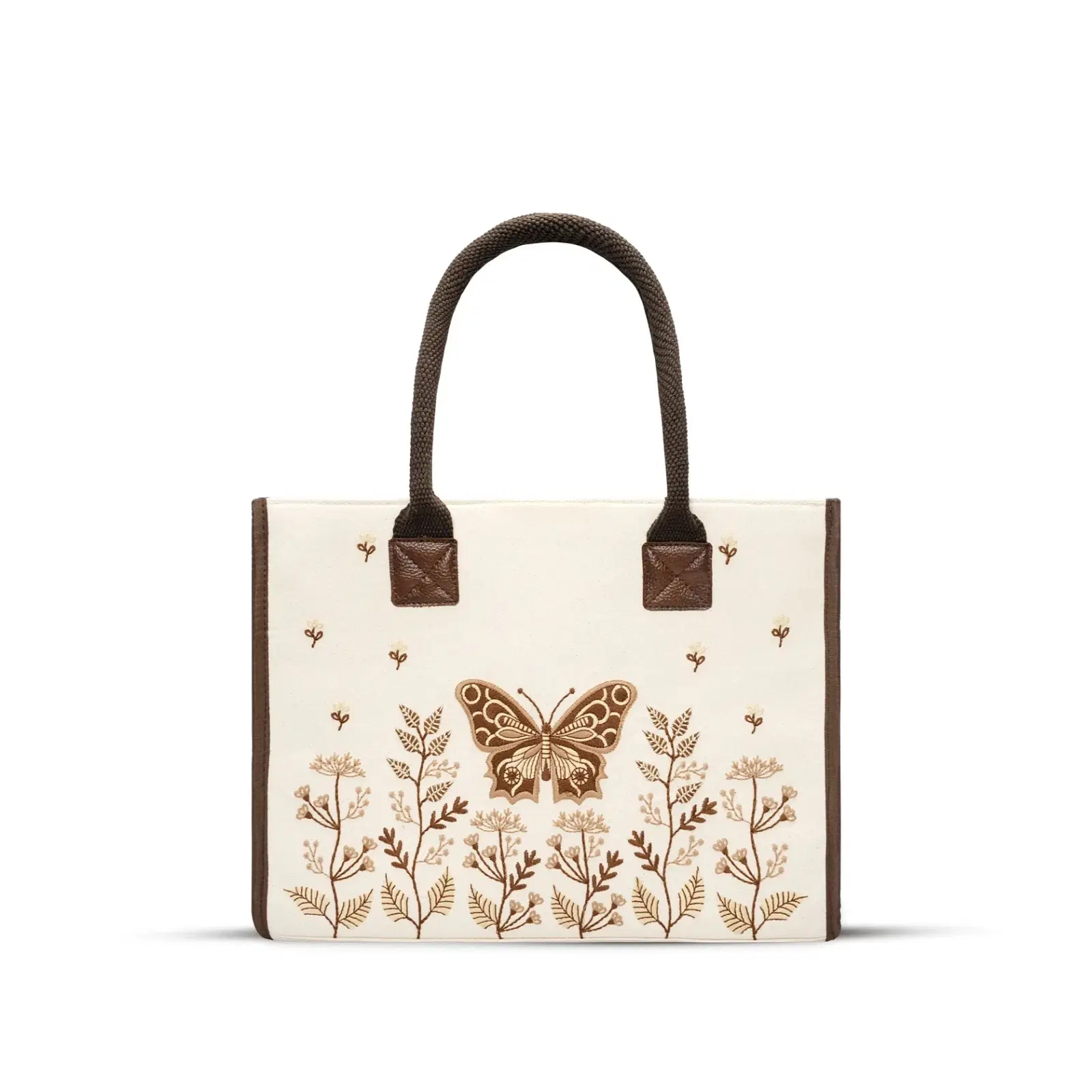 Front view of cream cotton tote with brown handles and butterfly floral embroidery