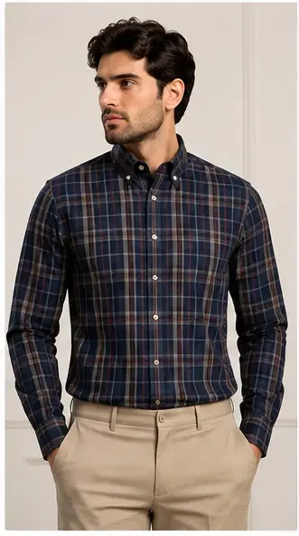 Front view of a men's navy plaid button-down shirt styled with beige trousers