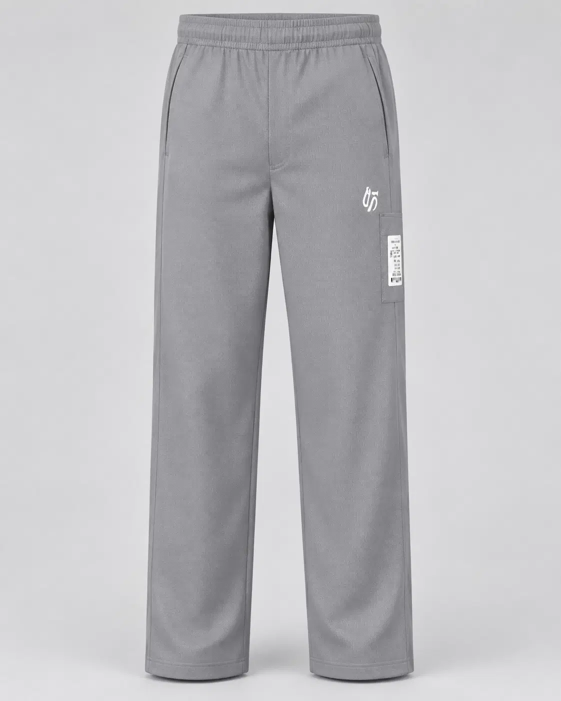 Front view of grey straight-leg track pants with elastic waist and side utility pocket patch