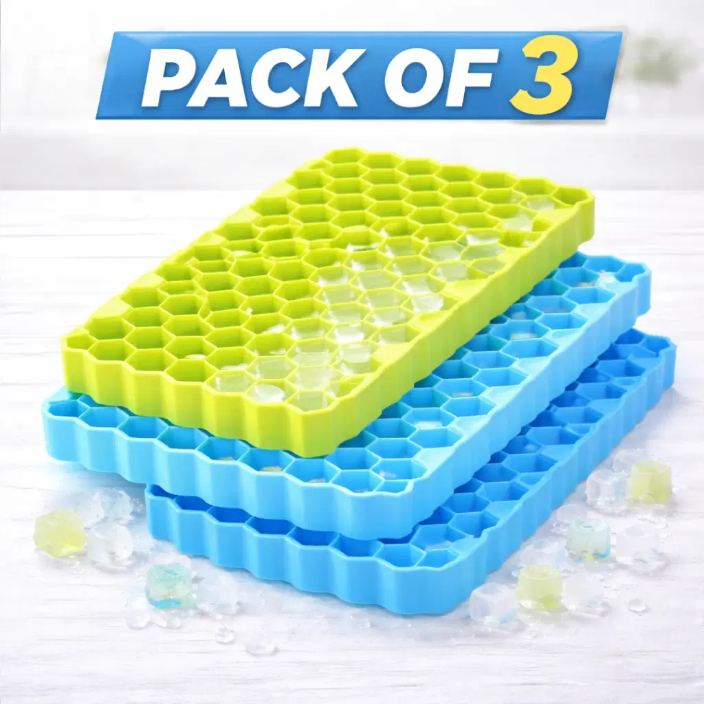 Three hexagon-cell silicone ice trays stacked in blue and lime green with ice cubes scattered around