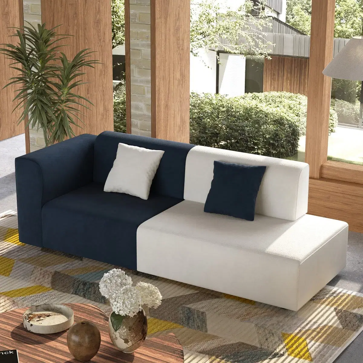 Angled front view of navy and white 2-seater sofa with two contrasting accent cushions