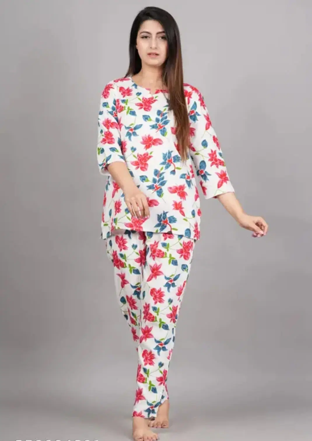 Front view of women's white lounge co-ord set with pink floral print and matching tapered pants