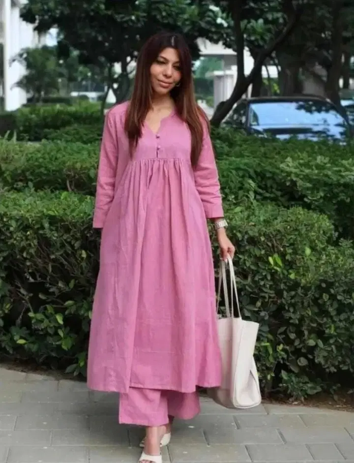 Front full-length view of pink A-line kurta set with gathered waist and matching palazzo pants