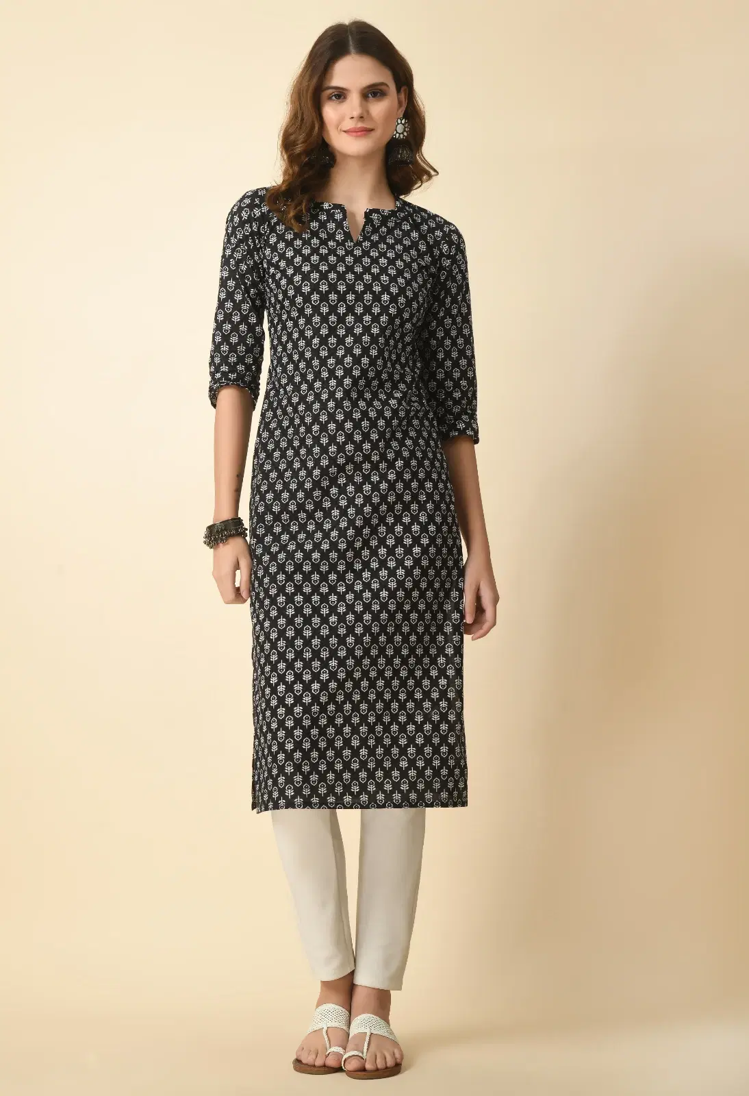 Front view of black straight kurta with white all-over print, notch neckline and three-quarter sleeves