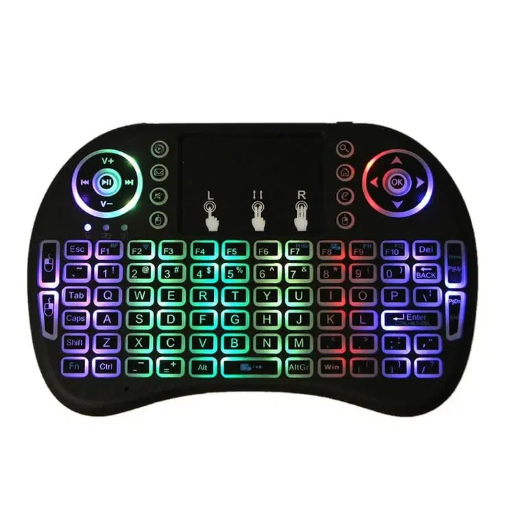 Front view of black mini keyboard with touchpad, dual control pads and rainbow backlit keys