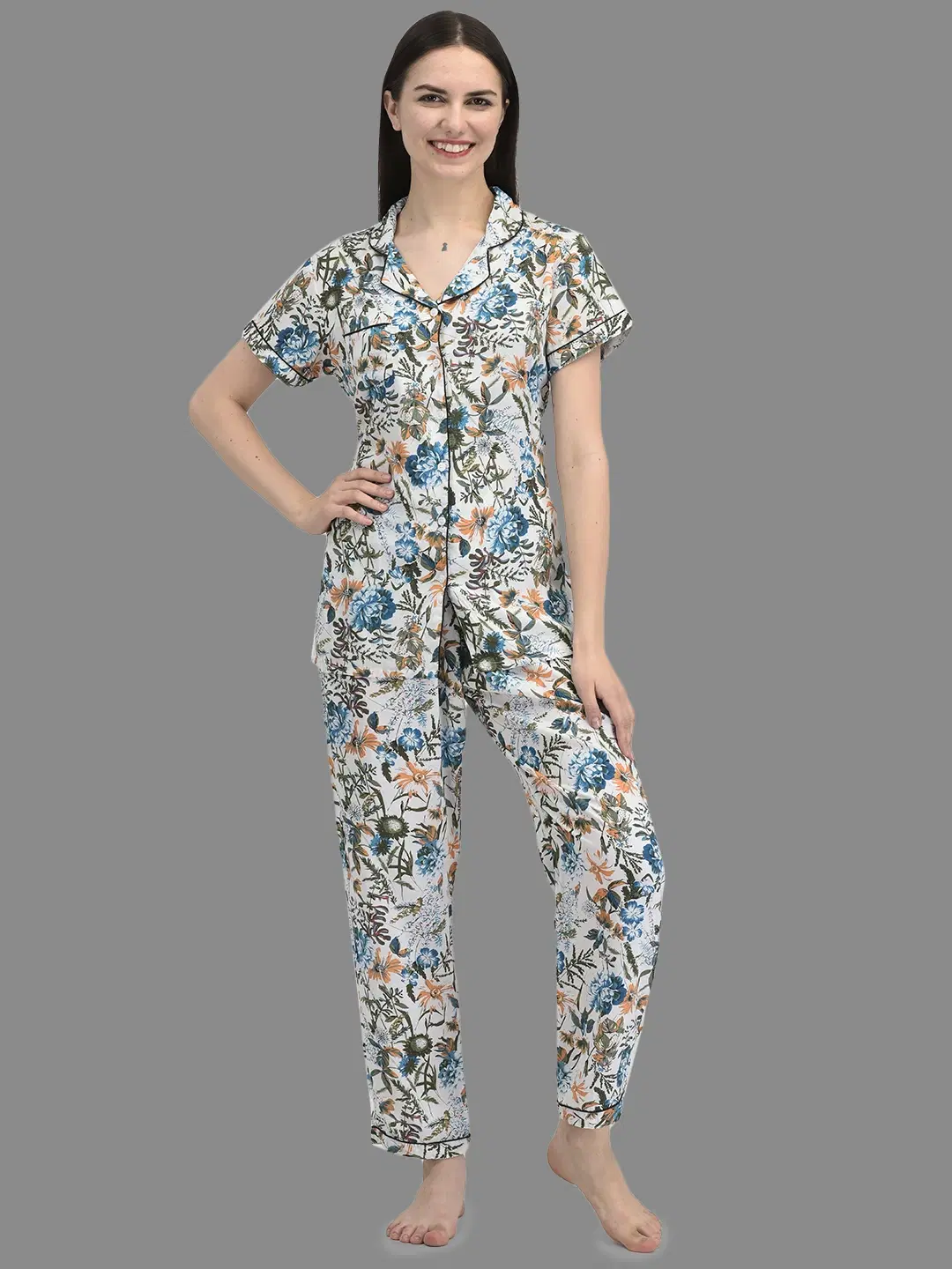 Front view of white floral night suit with short-sleeve collared shirt and full-length straight pyjama pants