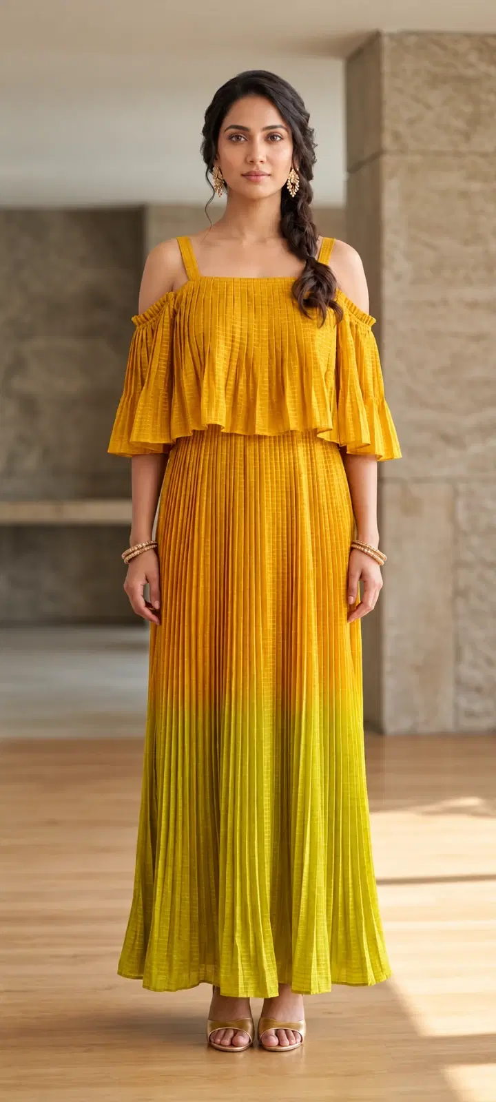 Front full-length view of mustard pleated cold-shoulder maxi dress with layered ruffle bodice