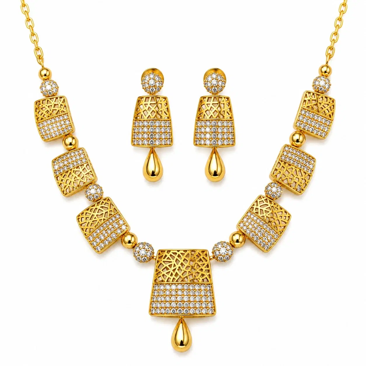 Gold-toned necklace and matching earrings set with geometric filigree design and white stone accents