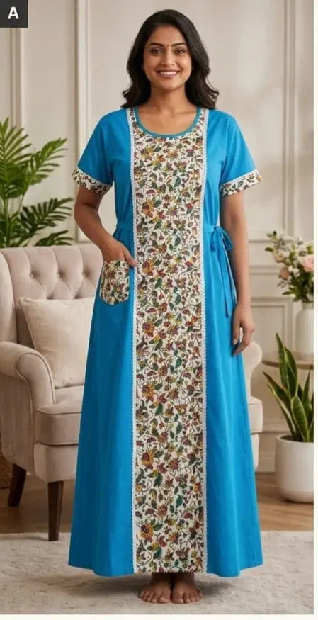 Woman wearing a blue full-length nighty with floral front panel, short sleeves, and side tie details