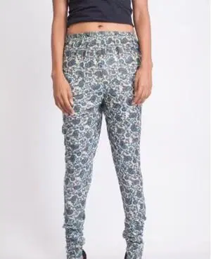Front view of slim-fit blue and grey floral print leggings worn with a black cropped top